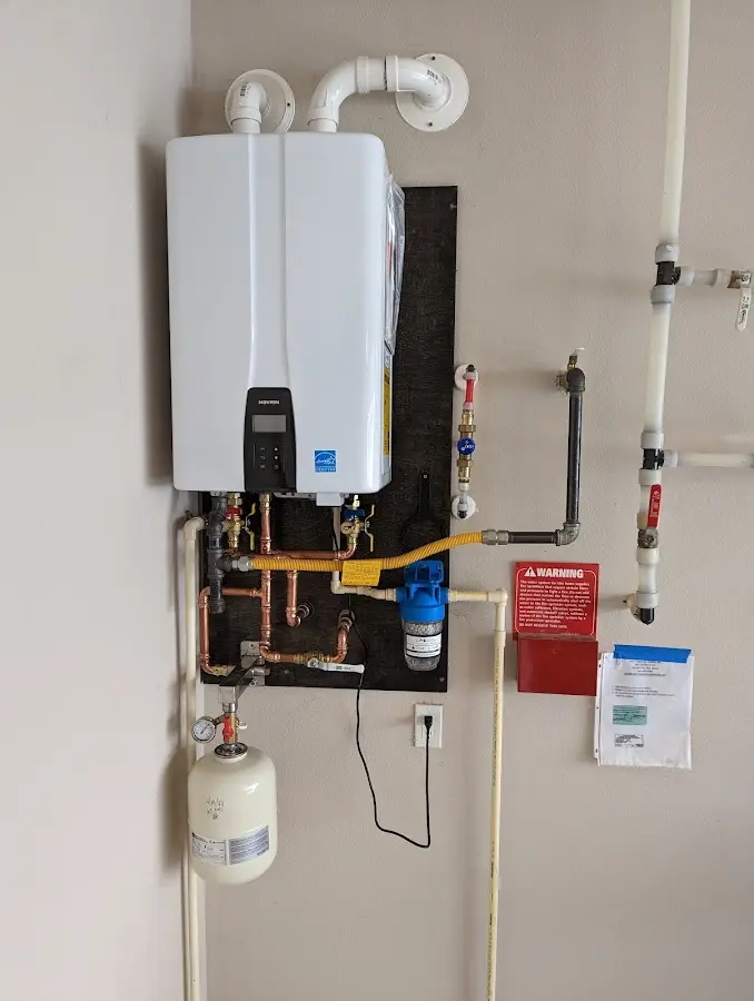 Professional plumber installing copper piping in a Bayonet Point home